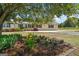 Charming single-story home with manicured front yard and mature landscaping, including a beautiful flower bed at 424 N Green Cir, Mcdonough, GA 30252