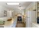 Bright eat-in kitchen equipped with modern appliances, ample countertop space, with easy access to the main dining area at 424 N Green Cir, Mcdonough, GA 30252