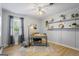 Bright home office with natural light, built-in shelves, and hardwood floors creating a functional workspace at 424 N Green Cir, Mcdonough, GA 30252