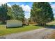 Exterior view of a backyard shed with a yard at 424 N Green Cir, Mcdonough, GA 30252