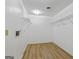 Spacious walk-in closet with wood look flooring, ample shelving, and hanging storage, offering plenty of space for organization at 424 N Green Cir, Mcdonough, GA 30252