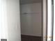 A walk in closet with light wood flooring and white shelving at 2338 Rambling Way, Lithonia, GA 30058
