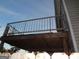 View of the deck from underneath, showing the wooden supports and metal railing at 2338 Rambling Way, Lithonia, GA 30058