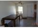 Dining room featuring new floors, neutral paint, a dining table, and a modern light fixture at 2338 Rambling Way, Lithonia, GA 30058
