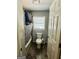 Cozy bathroom with tile flooring, bathtub with shower, and natural light from a window at 2232 Lee Sw St, Covington, GA 30014