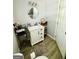 Compact bathroom featuring white vanity, modern fixtures, and clean finishes at 2232 Lee Sw St, Covington, GA 30014