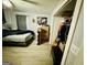 Bedroom with ceiling fan, laminate floor, and window letting in natural light at 2232 Lee Sw St, Covington, GA 30014
