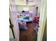 Bedroom featuring bunk beds, a ceiling fan and storage at 2232 Lee Sw St, Covington, GA 30014
