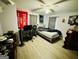 Bedroom with ceiling fan, laminate floor, and window letting in natural light at 2232 Lee Sw St, Covington, GA 30014