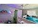 Cozy bedroom features fun wall decor, plush bedding, and a ceiling fan at 2232 Lee Sw St, Covington, GA 30014