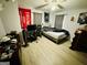 Bedroom with ceiling fan, laminate floor, and window letting in natural light at 2232 Lee Sw St, Covington, GA 30014
