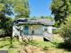 Charming single-story home with a covered porch and inviting blue front door at 2232 Lee Sw St, Covington, GA 30014
