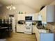 Bright kitchen features white cabinets, modern appliances, and ample counter space at 2232 Lee Sw St, Covington, GA 30014