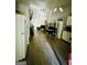 Bright living room with vaulted ceiling, fan, laminate flooring, and neutral decor at 2232 Lee Sw St, Covington, GA 30014