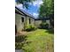 The backyard shows a well maintained lawn with some plants at 6127 Floyd Ne St, Covington, GA 30014