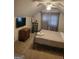 This bedroom has carpet, a small tv and dresser, as well as a full sized bed at 6127 Floyd Ne St, Covington, GA 30014