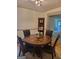 Dining room featuring a wooden table, chairs, corner shelf and hardwood flooring at 6127 Floyd Ne St, Covington, GA 30014