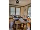 Dining room with seating for six with a blue and white centerpiece on hardwood floors at 6127 Floyd Ne St, Covington, GA 30014