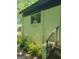 Exterior entrance with stairs, showing brick wall and some plants at 6127 Floyd Ne St, Covington, GA 30014