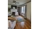 Cozy living room with a fireplace, hardwood floors, and comfortable seating at 6127 Floyd Ne St, Covington, GA 30014