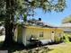 Backyard featuring mature tree, a grill, and a single door to access the residence at 7 Ivy St, Porterdale, GA 30014