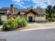 Community clubhouse featuring stone accents, well maintained landscaping and a parking lot for visiting residents at 1598 Renaissance Ne Dr, Conyers, GA 30012