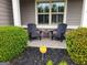 Inviting front porch featuring chairs and a small table perfect for enjoying the outdoors at 1598 Renaissance Ne Dr, Conyers, GA 30012