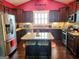 Modern kitchen with stainless steel appliances, granite countertops, and rich dark wood cabinetry at 1598 Renaissance Ne Dr, Conyers, GA 30012