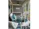 Charming screened porch featuring inviting furniture, and tasteful decor at 1598 Renaissance Ne Dr, Conyers, GA 30012