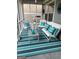 Relaxing screened porch with stylish furniture, a striped rug, and tasteful decorations at 1598 Renaissance Ne Dr, Conyers, GA 30012