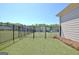 Fenced backyard with a view of a playground, offering privacy and a safe space for children to play at 609 Francis Ave, Peachtree City, GA 30269