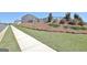Side yard view featuring a mulched garden area, privacy fence, and green lawn at 609 Francis Ave, Peachtree City, GA 30269