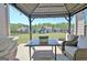 Inviting outdoor patio with seating and grill, plus a large backyard with a playground visible at 609 Francis Ave, Peachtree City, GA 30269