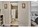 Neutral-toned bathroom featuring a tiled shower with glass doors and decorative gender signage at 609 Francis Ave, Peachtree City, GA 30269