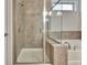 Tiled glass shower and soaking tub in a luxurious bathroom at 609 Francis Ave, Peachtree City, GA 30269