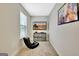 Bright bedroom featuring a gaming chair, a TV, and carpeted floors at 609 Francis Ave, Peachtree City, GA 30269