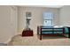 Bright bedroom featuring a twin bed, neutral walls, and a window with a view at 609 Francis Ave, Peachtree City, GA 30269