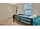 Bedroom featuring a wooden bed frame, carpet floors, and a view from the window at 609 Francis Ave, Peachtree City, GA 30269