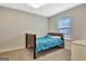 Bedroom featuring a wooden bed frame, a nightstand, and a window view at 609 Francis Ave, Peachtree City, GA 30269