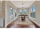 Dining room with natural light from the surrounding windows and an exterior door at 609 Francis Ave, Peachtree City, GA 30269