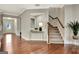 Inviting foyer with hardwood floors, staircase, and decor, leading to various rooms at 609 Francis Ave, Peachtree City, GA 30269