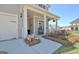 Inviting front porch with rocking chair seating and beautiful landscaping at 609 Francis Ave, Peachtree City, GA 30269