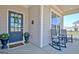 Cozy front porch featuring rocking chairs, decorative planters, and a welcoming entrance at 609 Francis Ave, Peachtree City, GA 30269