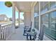 Charming front porch featuring rocking chairs, hanging plants, and a peaceful neighborhood view at 609 Francis Ave, Peachtree City, GA 30269