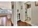 Hallway featuring hardwood floors that leads to an adjacent bathroom at 609 Francis Ave, Peachtree City, GA 30269
