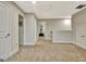 Hallway with carpeted floors and neutral-colored walls provides access to multiple rooms at 609 Francis Ave, Peachtree City, GA 30269