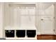 Hallway features a stylish coat rack with storage cubbies and a white door at 609 Francis Ave, Peachtree City, GA 30269