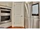 Stainless steel refrigerator and double ovens near a pantry door and wood flooring at 609 Francis Ave, Peachtree City, GA 30269
