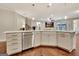 Kitchen island featuring stainless steel dishwasher with an open view to the Gathering room at 609 Francis Ave, Peachtree City, GA 30269