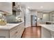 Spacious kitchen with stainless steel appliances, white cabinetry, and hardwood flooring at 609 Francis Ave, Peachtree City, GA 30269